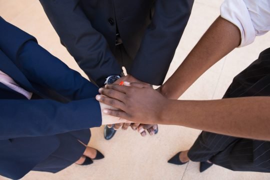 Teamwork, support or friendship gesture Teamwork, support or friendship gesture. Stack of hands of mix raced business professionals. United team concept